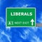 LIBERALS road sign against clear blue sky