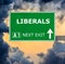 LIBERALS road sign against clear blue sky