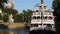 Liberty Square Riverboat sailing and partial view of Cinderella Castle at Magic Kingdom 