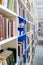 Library with bookcases. Many different books on the shelves. Large selection of books in a bookcase. Blur background.