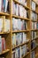 Library books stacked on wooden shelves