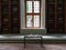 Library with reading room at Topkapi Palace. Small table and two shelfs of books with window at the middle