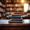 Library serenity Books stacked on wooden table, blurred bookshelf backdrop