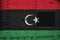 Libya flag depicted on side part of military armored tank closeup. Army forces conceptual background