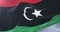 Libya flag waving at wind with blue sky in slow, loop