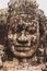 Lichen-covered Stone Head Statue Face-On in Angkor Wat, Siem Reap, Cambodia, Indochina, Asia - face on in colour