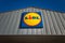 The Lidl sign on the Lidl discount store on blue sky