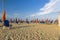 Lido beach with closed umbrellas on a windy day