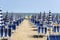 LIDO DI JESOLO, ITALY: Umbrellas on the beach of Lido di Jesolo at adriatic Sea in a beautiful summer day, Italy. On the beach of