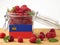 Liechtenstein flag on a wooden panel with raspberries isolated o