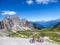 Lienz Dolomites - Mountain bike lying on the side of a gravelled road in tall mountains