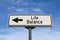Life balance road sign, arrow on blue sky background. One way blank road sign with copy space. Arrow on a pole pointing in one