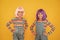 Life is better with friends. Happy girls friends on yellow background. Little friends smile in fashionable hair wigs and