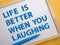 Life is better when you laughing, text words typography written on whiteboard against yellow background, life and business