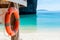 Life buoy against the background of the bay of the sea