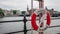 Life buoy hanging near river in the center of Stockholm,  Sweden, 10 august 2018