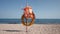 Life Buoy and Life Jacket on Beach in Seascape. Concept of Lifeguards in Resorts