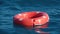 Life buoy or rescue buoy floating on sea to rescue people from drowning man. Slow motion. Close up