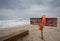 Life buoy and sign dangerous to swim