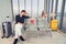 Life during covid-19 pandemic. young man and woman waiting for flying at airport at window with a passport