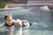 Life guard woman holding sinking senior people swimming in water,female lifesaver helping elderly person in summer vacation,first