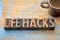 Life hacks word abstract in wood type