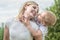 Life moment of happy family!Little boy tenderly embraces his mother.