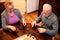 Life partners playing a game of dominos