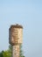 Life and reproduction of white storks. stork nest. White storks built a nest on a rural water tower in the spring and