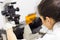 Life science researcher microscoping in genetic scientific laboratory.