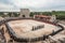 life-size gladiator battle arena, with spectators watching in the background