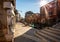 Life size statue embedded in wall on canal pathway in Venice, Italy