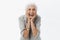 Life only starts when get older. Portrait of charming happy and carefree european senior woman with grey hair laughing