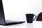 Life style technology with Black coffee cup and labtop on white backgrounds