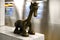 Life Underground. Cute bronze subway sculpture against background of passing train. New York City Subway`s 14th Street/Eighth Ave