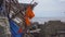 A life vest hanging on the debris of a fishing ship on a rocky seaside. Shipwreck concept. No one survived in a