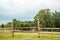 Life in the village. Wooden gate with an old deadbolt. Country fence.Nature in the summer at sunset. fields and pasture of cows