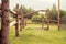 Life in the village. Wooden gate with an old deadbolt. Country fence.Nature in the summer at sunset. fields and pasture of cows