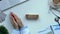 Life word made of wooden cubes on table, doctor hands showing toy heart top view