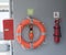 Lifebelt, a small bulifebuoy and fire extinguisher on a yacht