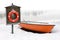 Lifeboat and lifebuoy on the snow