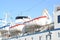 Lifeboats installed on large white passenger liner deck