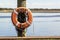 A lifebuoy attached to a dock post on the pier in Vienna, Maryland