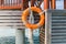 Lifebuoy on beach patio or terrace in sea water