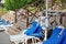 Lifebuoy with blue sunbeds at empty beach