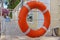 Lifebuoy on the breakwater against the background of the beach