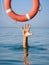 Lifebuoy for drowning man in sea or ocean water.