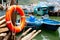 Lifebuoy and fishing boats in fishing village Tai O in Lantau island, Hong Kong