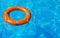 Lifebuoy floating in swimming pool