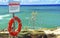 Lifebuoy flotation device & instruction sign at seaside
